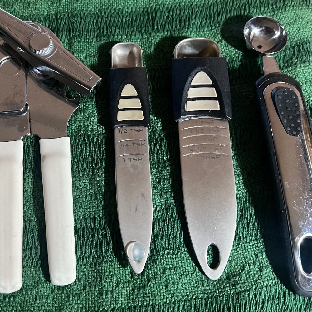 Kitchen Tools.....Manuel Can opener, Small Melon Scoop, TableSpoon, Teaspoon